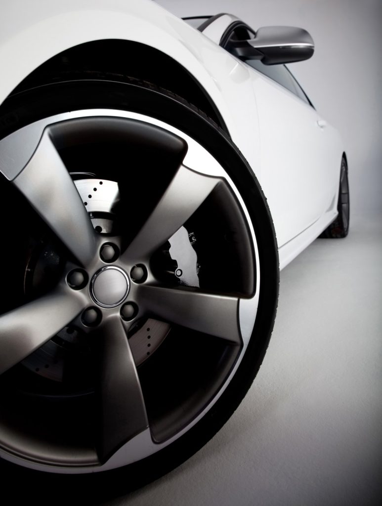 closeup of a white sports car's wheel